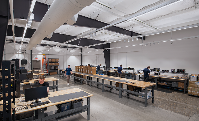 People assembling servers